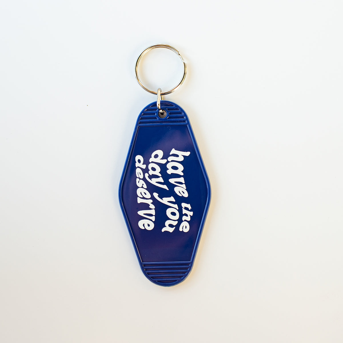 Have the Day You Deserve Motel Keychain